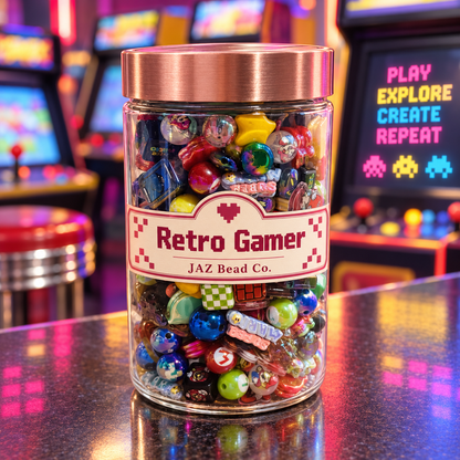 Clear JAZ Bead Co. jar labeled Retro Gamer with a rose-gold lid, filled with colorful gaming-inspired beads in blue, red, green, yellow and black, displayed against glowing arcade machines and joystick controls.
