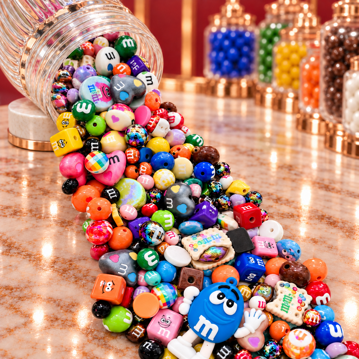 Close-up of the Chocolate Candies bead mix showing colorful candy-inspired rounds, heart-shaped beads, character cubes, cookie and candy focal pieces, glossy orange, green, blue, yellow and purple beads, and dimensional character-inspired accents.