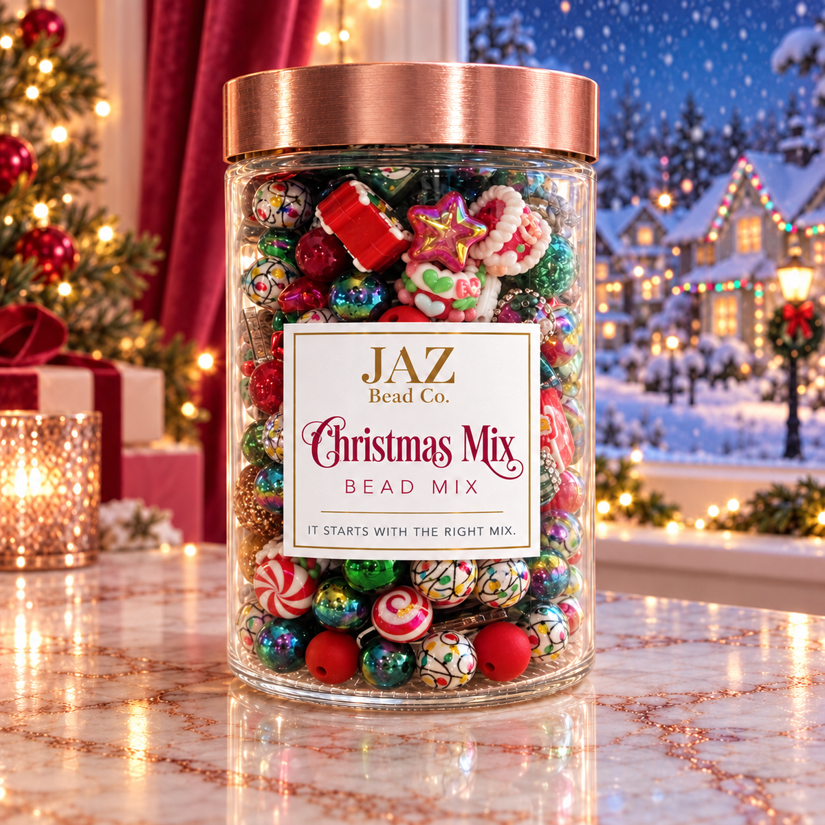 Clear JAZ Bead Co. jar labeled Christmas Mix with a rose-gold lid, filled with red, green, white and iridescent holiday beads, including peppermint stripes, Christmas-light patterns and festive focal pieces, displayed beside a decorated Christmas tree and snowy window scene.