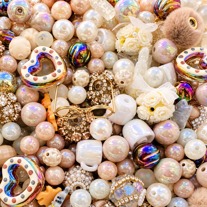 Close-up of Memaw’s Pearls bead mix showing lustrous pearls, soft neutral and iridescent beads, gold eyeglasses, teacups, floral beads, hearts and textured accents.